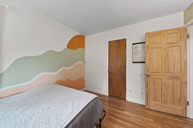 2618 Greencliff Dr, East Lansing, MI 48823 - bedroom with wood finished floors and baseboards