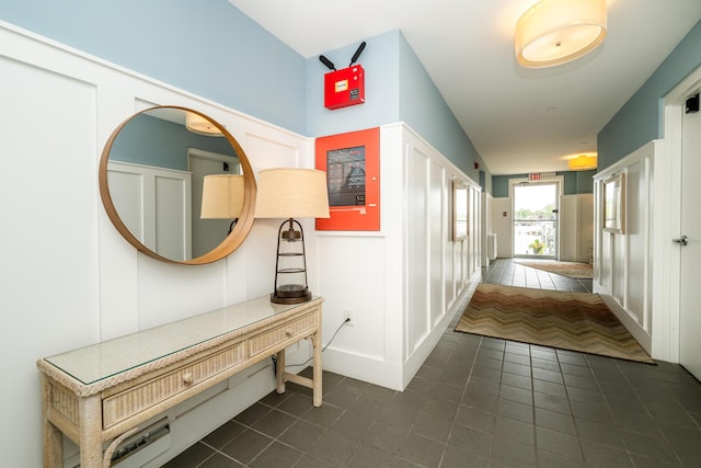 240 Water St Unit 1A, Saint Joseph, MI 49085 - hall with dark tile patterned floors and a decorative wall