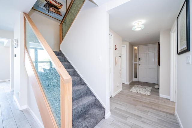 240 Water St Unit 1A, Saint Joseph, MI 49085 - stairway featuring wood finished floors and baseboards