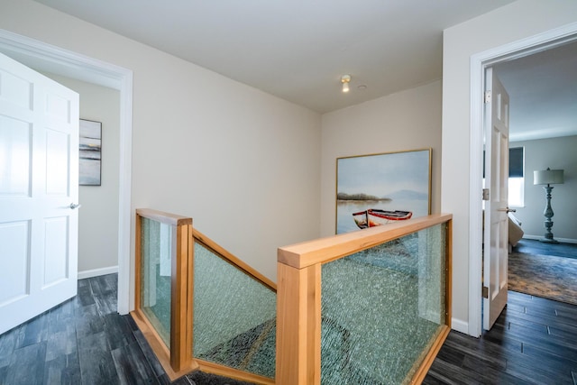 240 Water St Unit 1A, Saint Joseph, MI 49085 - hallway with an upstairs landing, wood finished floors, and baseboards