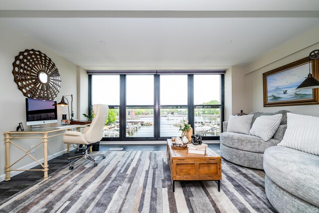 240 Water St Unit 1A, Saint Joseph, MI 49085 - living area with a wall of windows, wood finished floors, plenty of natural light, and a desk