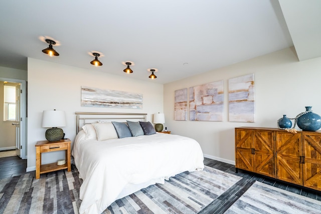 240 Water St Unit 1A, Saint Joseph, MI 49085 - bedroom featuring baseboards and wood finished floors