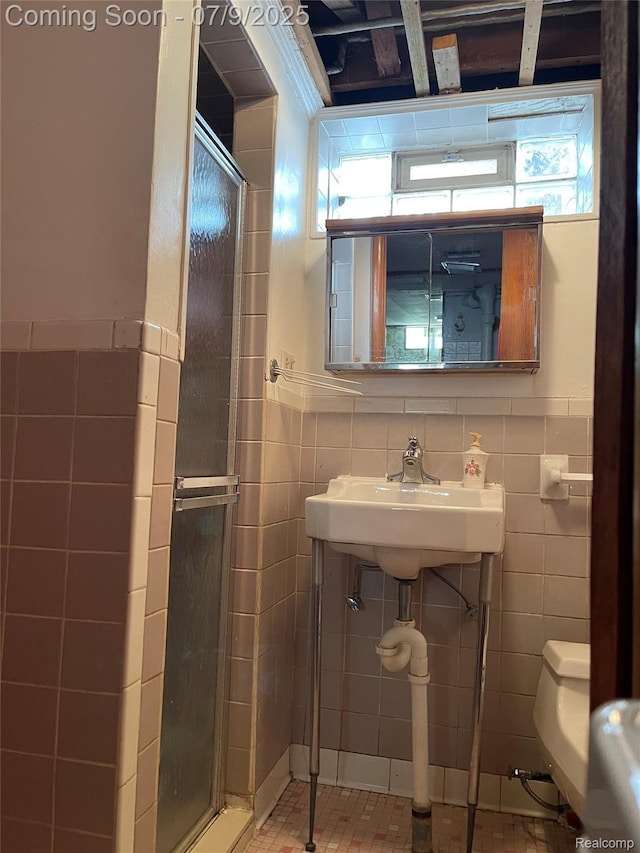 6250 Grandville Ave, Detroit, MI 48228 - bathroom featuring tile walls, a stall shower, and a wainscoted wall