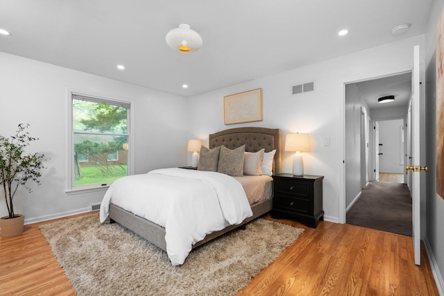 3673 Pheasant Dr, Ann Arbor, MI 48103 - bedroom with light wood finished floors, baseboards, and recessed lighting