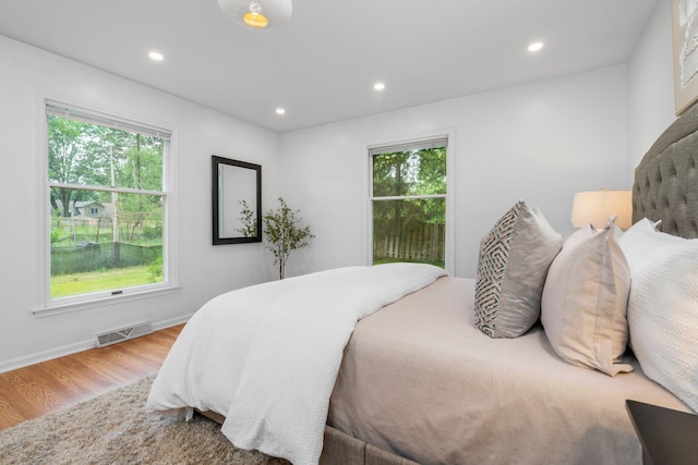 3673 Pheasant Dr, Ann Arbor, MI 48103 - bedroom with wood finished floors and recessed lighting