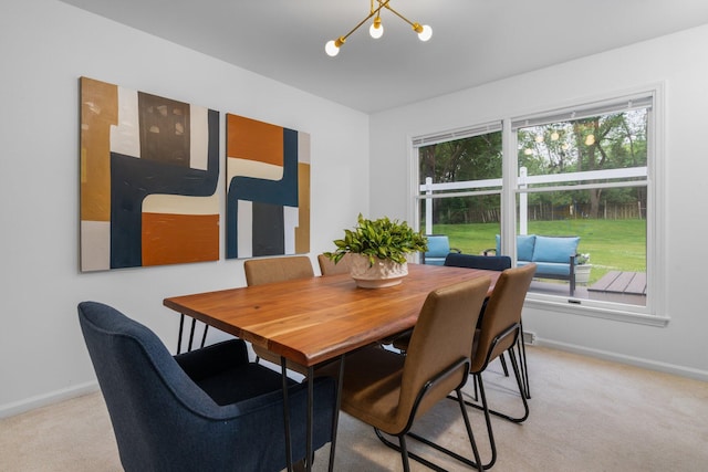 3673 Pheasant Dr, Ann Arbor, MI 48103 - dining room featuring light colored carpet, baseboards, and a chandelier