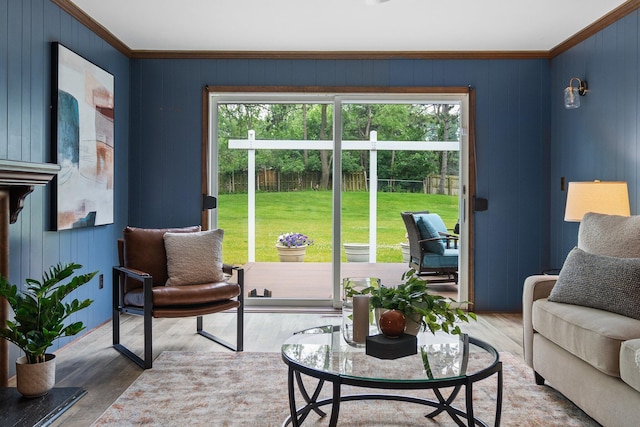 3673 Pheasant Dr, Ann Arbor, MI 48103 - living room with plenty of natural light, ornamental molding, wood walls, and wood finished floors