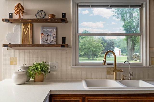 3673 Pheasant Dr, Ann Arbor, MI 48103 - kitchen with a sink, decorative backsplash, light countertops, and open shelves