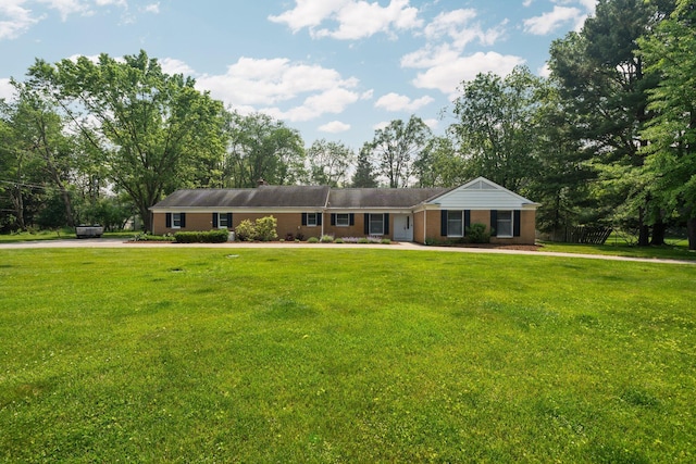 3673 Pheasant Dr, Ann Arbor, MI 48103 - single story home featuring a front lawn and view of scattered trees