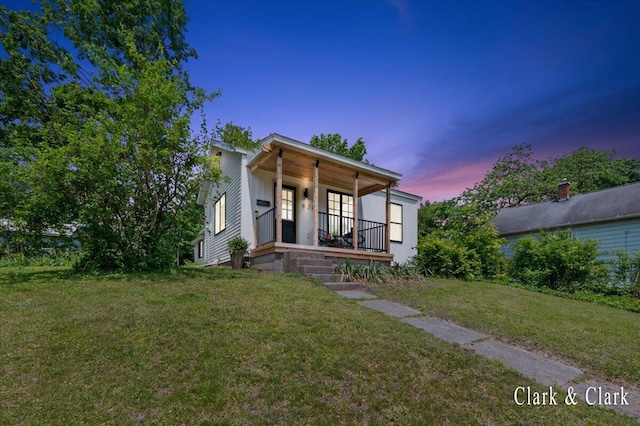 820 Hackett St, Ionia, MI 48846 - view of front of property featuring a porch and a front yard