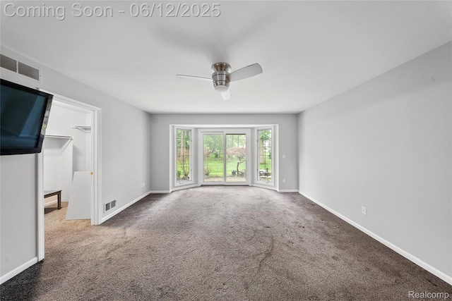 8487 Sherwood Dr, Grosse Ile, MI 48138 - spare room featuring a ceiling fan, carpet, and baseboards