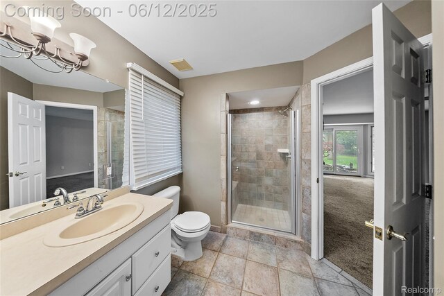 8487 Sherwood Dr, Grosse Ile, MI 48138 - bathroom with vanity, toilet, a stall shower, and a chandelier