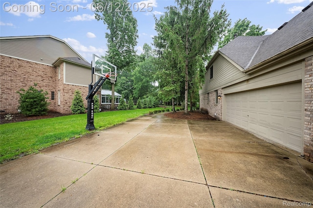 8487 Sherwood Dr, Grosse Ile, MI 48138 - view of side of property with brick siding, concrete driveway, a yard, and a garage