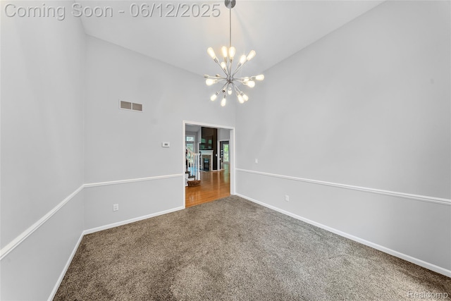 8487 Sherwood Dr, Grosse Ile, MI 48138 - carpeted empty room featuring a chandelier and baseboards