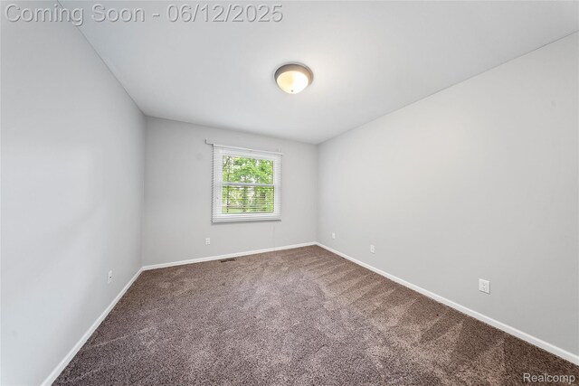 8487 Sherwood Dr, Grosse Ile, MI 48138 - spare room featuring carpet flooring and baseboards