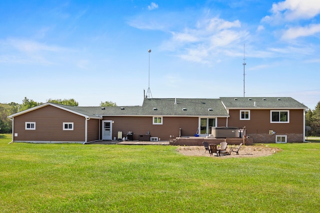5886 13 Mile Rd, Remus, MI 49340 - rear view of house with a hot tub, a lawn, a wooden deck, and a patio