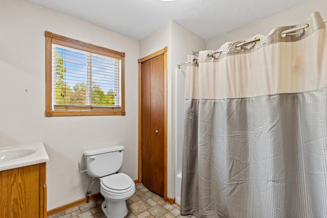 5886 13 Mile Rd, Remus, MI 49340 - bathroom with stone finish flooring, vanity, baseboards, shower / bath combination with curtain, and toilet