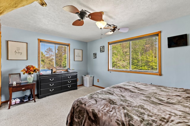 5886 13 Mile Rd, Remus, MI 49340 - carpeted bedroom with baseboards, ceiling fan, and a textured ceiling