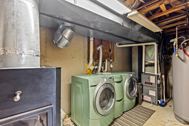 5886 13 Mile Rd, Remus, MI 49340 - washroom featuring washing machine and clothes dryer and heating unit