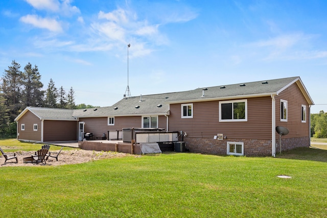 5886 13 Mile Rd, Remus, MI 49340 - rear view of property featuring a lawn and a fire pit