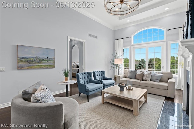 5624 Knob Hill Cir, Clarkston, MI 48348 - living area featuring a towering ceiling, crown molding, a chandelier, and recessed lighting