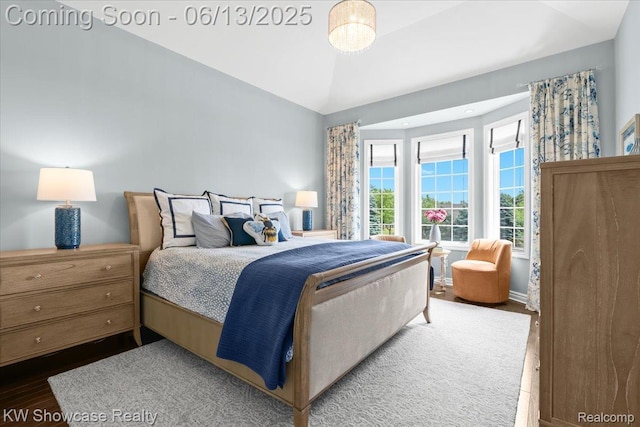 5624 Knob Hill Cir, Clarkston, MI 48348 - bedroom featuring vaulted ceiling and wood finished floors