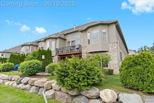5624 Knob Hill Cir, Clarkston, MI 48348 - rear view of property with a balcony and brick siding