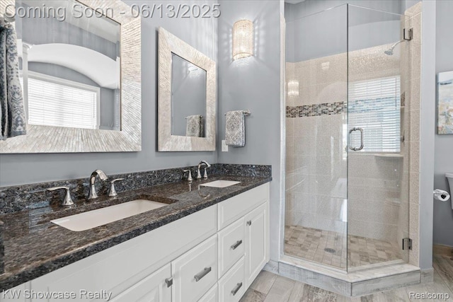 5624 Knob Hill Cir, Clarkston, MI 48348 - bathroom featuring a stall shower and double vanity