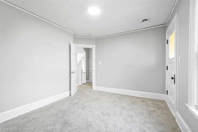 3054 Cadillac Blvd, Redford, MI 48214 - carpeted spare room featuring crown molding and baseboards