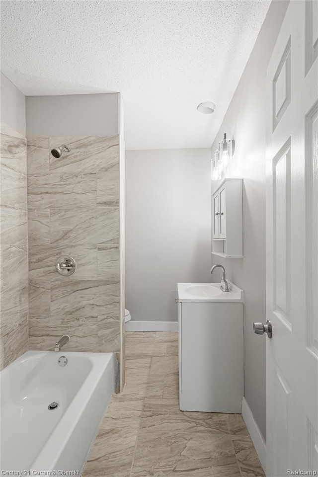 3054 Cadillac Blvd, Redford, MI 48214 - full bathroom with vanity, a textured ceiling, toilet, washtub / shower combination, and baseboards