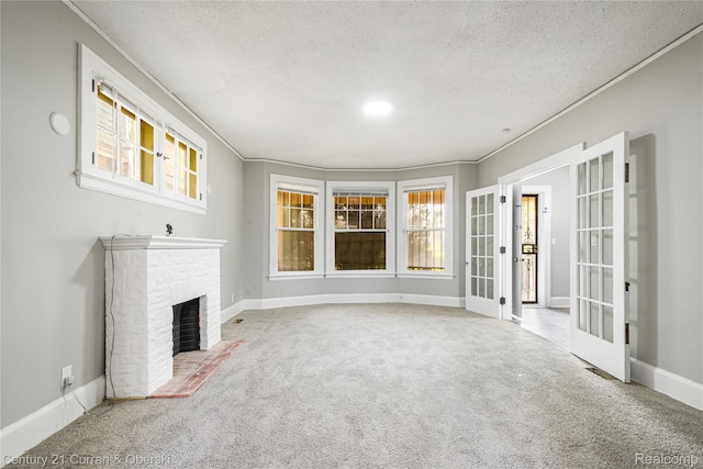 3054 Cadillac Blvd, Redford, MI 48214 - unfurnished living room featuring french doors, carpet floors, a textured ceiling, a brick fireplace, and baseboards