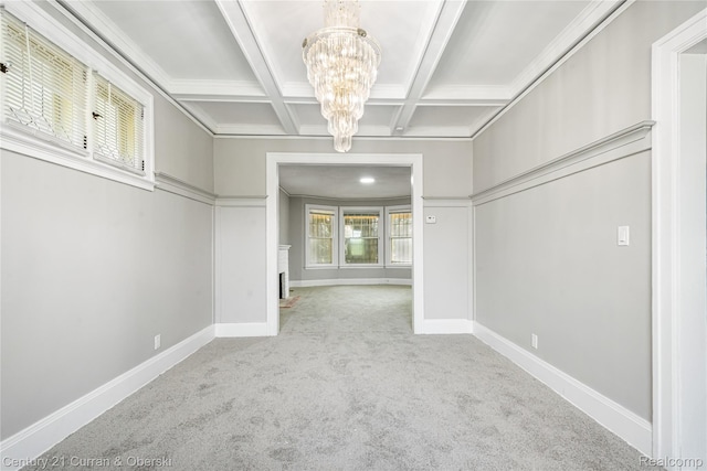 3054 Cadillac Blvd, Redford, MI 48214 - spare room featuring a chandelier, carpet floors, coffered ceiling, baseboards, and beamed ceiling