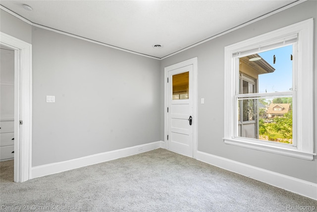 3054 Cadillac Blvd, Redford, MI 48214 - carpeted spare room featuring baseboards, crown molding, and a smoke detector