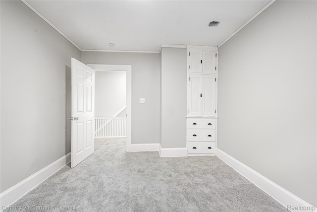 3054 Cadillac Blvd, Redford, MI 48214 - unfurnished bedroom featuring crown molding, carpet flooring, and baseboards