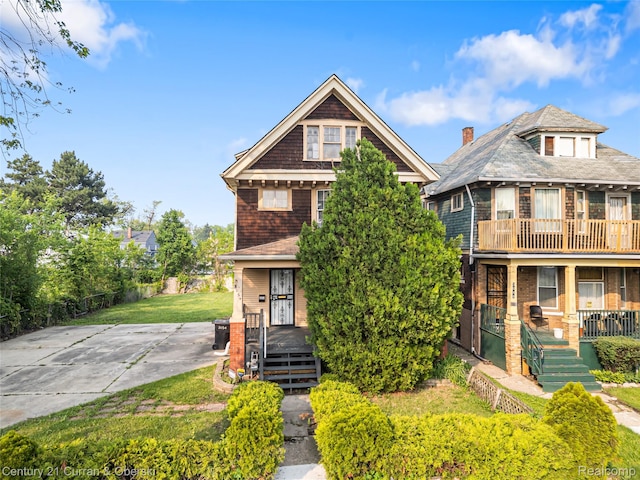 3054 Cadillac Blvd, Redford, MI 48214 - view of front of property with covered porch, a chimney, and a front lawn