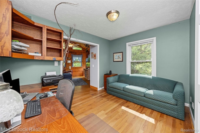 1982 E Coon Lake Rd, Howell, MI 48843 - home office featuring wood finished floors and a textured ceiling