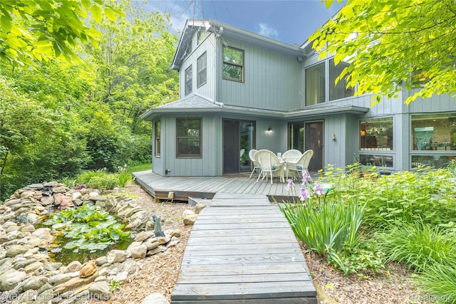 1982 E Coon Lake Rd, Howell, MI 48843 - rear view of property with a deck