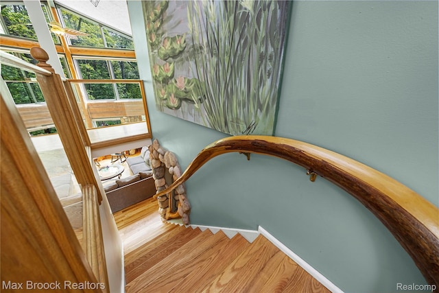 1982 E Coon Lake Rd, Howell, MI 48843 - stairway featuring wood finished floors