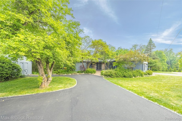 1982 E Coon Lake Rd, Howell, MI 48843 - obstructed view of property with a front yard and driveway
