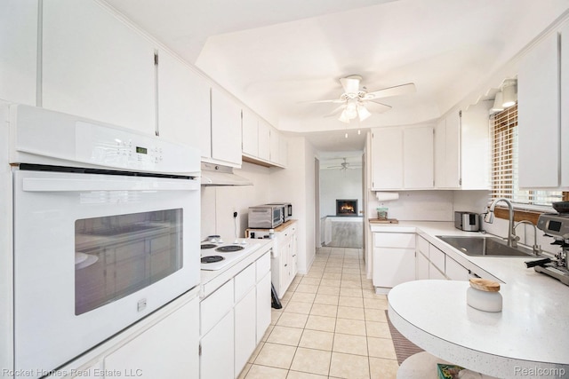 2095 Garry Dr, Troy, MI 48083 - kitchen featuring white appliances, a ceiling fan, light countertops, and under cabinet range hood