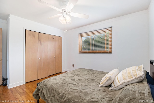 2095 Garry Dr, Troy, MI 48083 - bedroom with wood finished floors, a closet, and ceiling fan