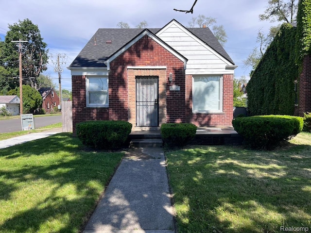 18334 Sunderland Rd, Detroit, MI 48219 - bungalow-style house with brick siding, a front lawn, and a shingled roof
