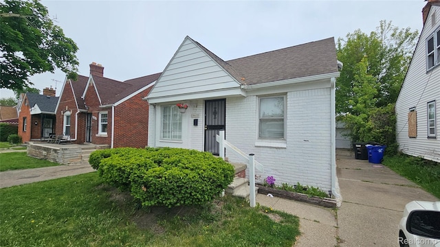 19610 Westphalia St, Detroit, MI 48205 - view of front of home with brick siding and a shingled roof