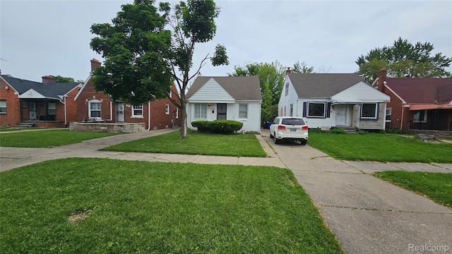19610 Westphalia St, Detroit, MI 48205 - bungalow with a front lawn and driveway