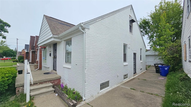 19610 Westphalia St, Detroit, MI 48205 - view of home's exterior featuring roof with shingles
