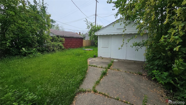 19610 Westphalia St, Detroit, MI 48205 - view of yard with a garage