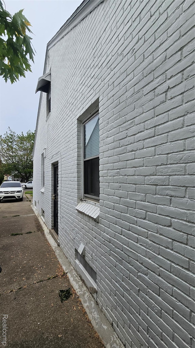 19610 Westphalia St, Detroit, MI 48205 - view of home's exterior featuring crawl space and brick siding