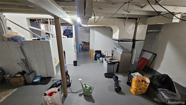 19610 Westphalia St, Detroit, MI 48205 - unfinished basement featuring concrete block wall and heating unit