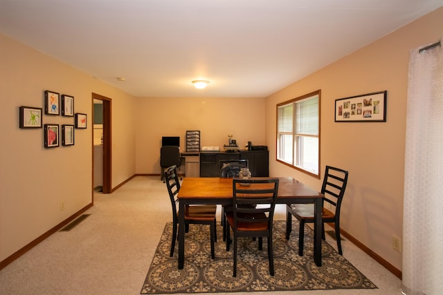 10926 Gorsline Rd, Battle Creek, MI 49014 - dining area featuring light carpet and baseboards