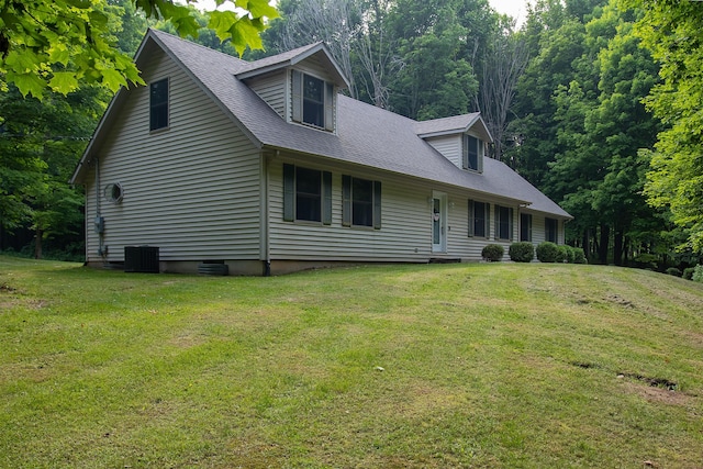 10926 Gorsline Rd, Battle Creek, MI 49014 - new england style home featuring a front lawn, central air condition unit, and roof with shingles